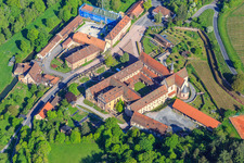 Schrägluftbild von Hotel Kloster Bronnbach mit Abteigarten,  Abteikirche Mariä Himmelfahrt und Missionare d. Heiligen Familie Kloster Bronnbach aus Süden in Wertheim im Bundesland Baden-Württemberg, Deutschland